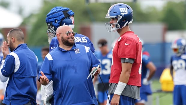 Jul 29, 2022; East Rutherford, NJ, USA; New York Giants head coach Brian Daboll talks to quarterback Daniel Jones (8) during training camp at Quest Diagnostics Training Facility.